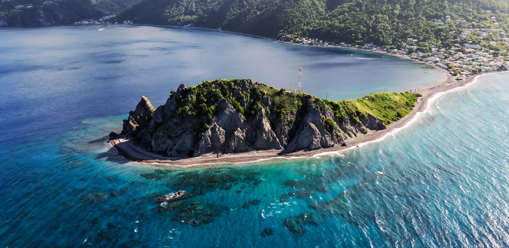 The Scotts Head isthmus with Caribbean and Atlantic seas on either side, a dramatic emblem of the dominica nature island south coast.