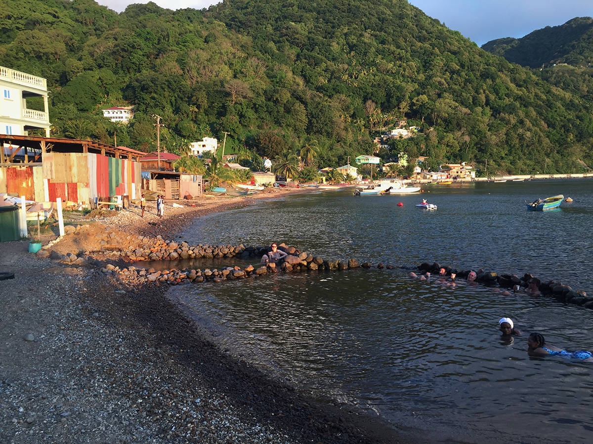 Waist-deep clear water with volcanic sand ripples at Bubbles Beach, champagne reef dominica style vents without the tour-boat crowds, Dominica.