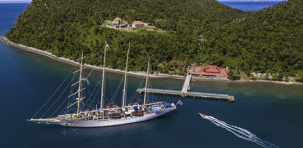 Restored stone ramparts of Fort Shirley above Prince Rupert Bay within cabrits national park, where rainforest meets historic cannons on the north coast.