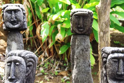 Carved wooden figures and craft exhibits inside the visitor centre, kalinago cultural village dominica storytelling through traditional artwork, Dominica.