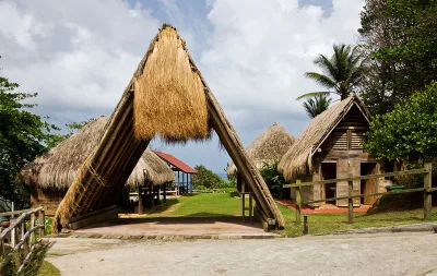 Reconstructed Kalinago dwellings and interpretive displays at Kalinago Barana Aute, kalinago barana aute cultural village facing the Atlantic shore, Dominica.