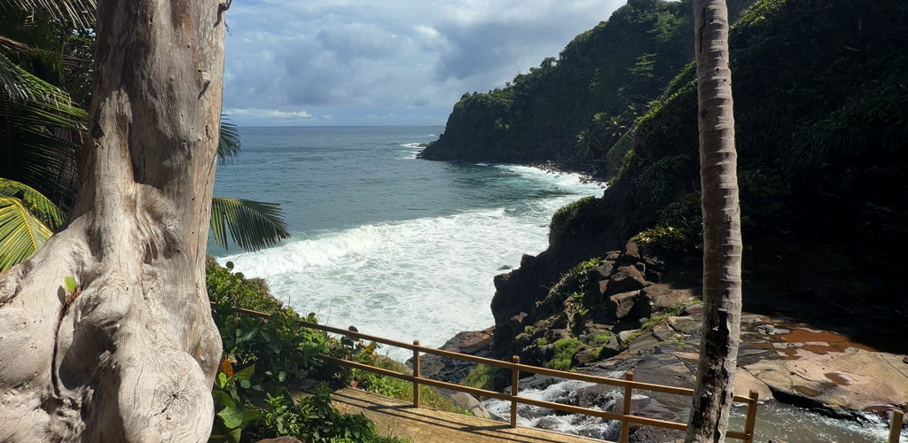 Thatched Kalinago dwellings on Atlantic ridges in the Kalinago Territory, kalinago territory dominica’s indigenous east-coast reserve above the sea, Dominica.