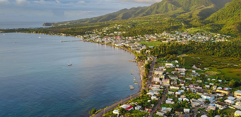 Prince Rupert Bay’s wide anchorage with Portsmouth town and Cabrits headland, portsmouth dominica’s busy north-coast boating and yachting hub.