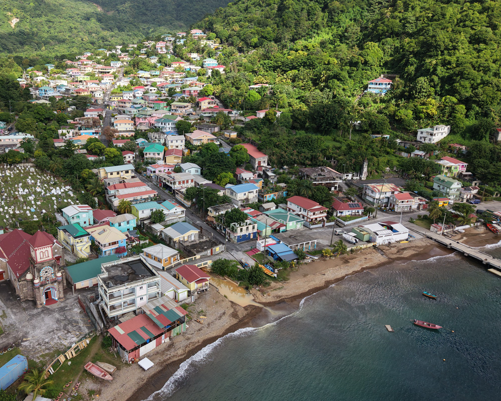 Soufrière village roofs and pier along the sheltered bay, soufriere dominica’s fishing settlement gateway to Titou Gorge and the marine reserve, Dominica.